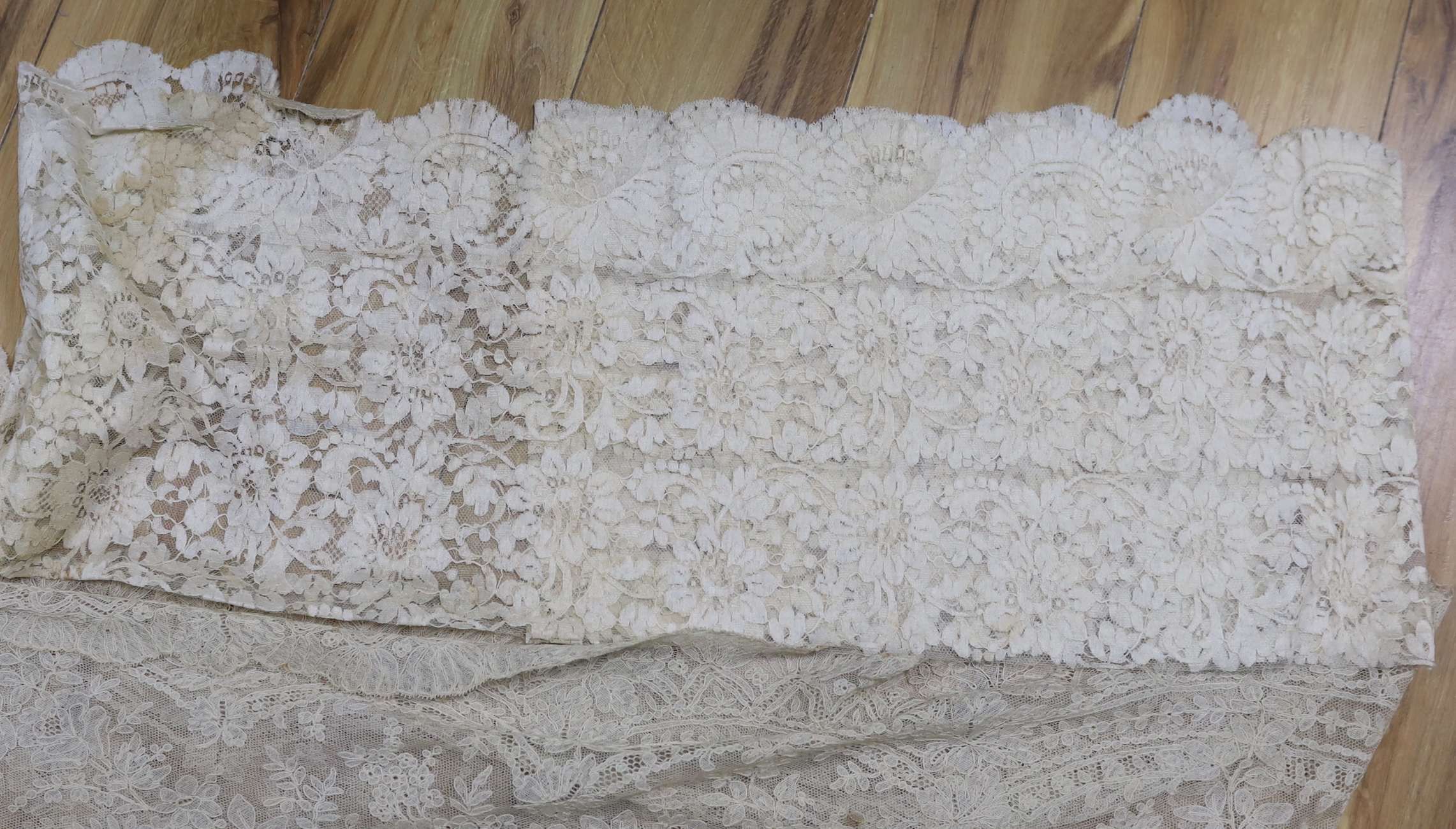 Two pieces of machine lace and a Honiton lace table mat
